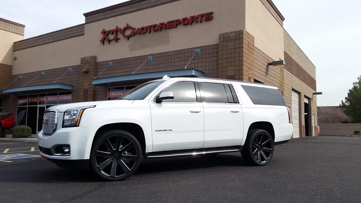 This 2015 GMC Yukon XL is rolling on 24" Dub wheels wrapped in Toyo ST...