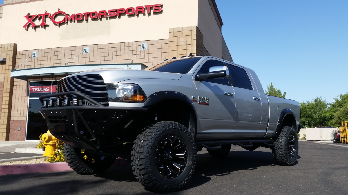 We had Keith's 2014 Ram 2500 in a while back and had a apply some major attitude to this beast. We put on a ReadyLift 6" suspension lift with Icon Vehicle Dynamics front and rear adjustable trac bar & 2.5" V.S. Series CDCV piggyback reservoir front and rear shocks, Addictive Desert Designs front Standard bumper w/Stealth Panels, & rear Honey Badger bumper w/tool boxes, Rigid Lighting all around including three D2 XL Hyperspot lights, two D2 XL Driving lights, & two pair of Dually SAE/DOT fog lights, 37x13.50R20 Copper SST Pro tires wrapped around some 20" Fuel Off Road Black Assault wheels, & finished off with a set of N-Fab nerf bars w/bed access.
