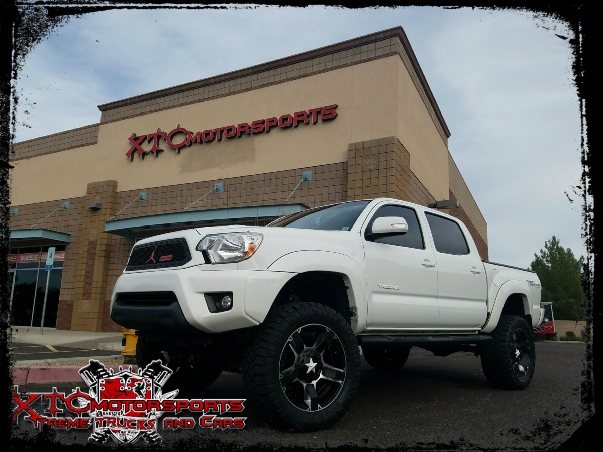 Tessa Powell brought us her 2014 Toyota USA Tacoma for a 6" BDS Suspension lift with BDS NX2 Series Nitro shocks, and it is standing on some 33x12.50R20 Nitto Tire Ridge Grappler tires wrapped around some XD wheels Rockstar 2 Matte Black & machined wheels with a White Star.