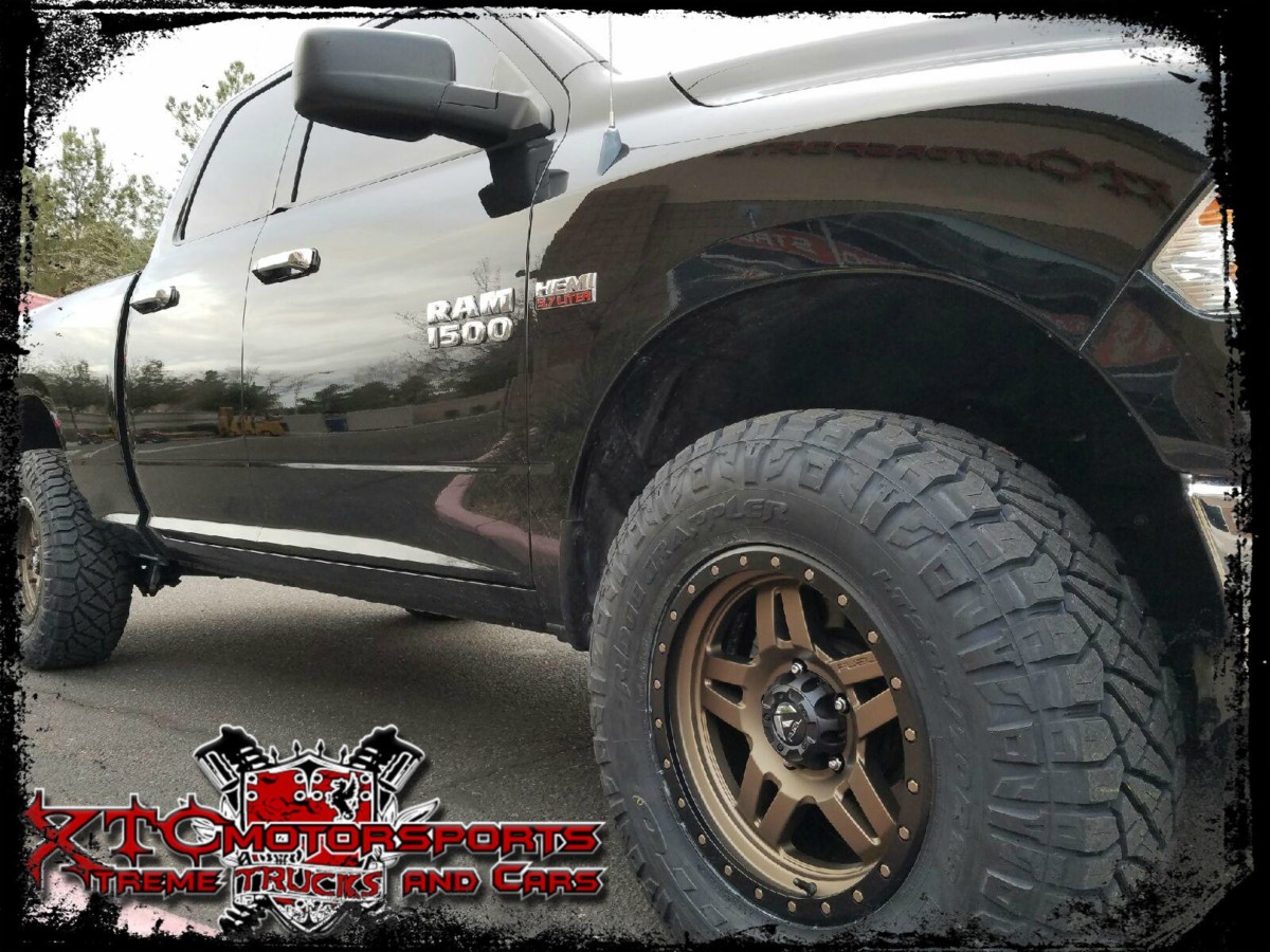 Trevor brought us his 2014 Ram Trucks 1500 for a ReadyLift Suspension Inc. 2.5" SST lift kit, Bilstein Shock Absorbers 5100 series front struts & rear shocks, 295/70R18 Nitto Tire Ridge Grapplers wrapped around 18x9 Fuel Offroad matte bronze with black ring Anza wheels.