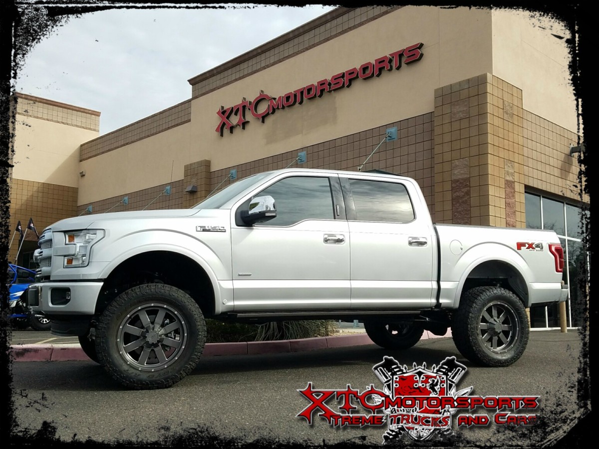 Troy dropped his 2016 Ford Motor Company F150 Platinum for a ReadyLift Suspension Inc. 7" suspension lift with Fox Racing 2.0 series rear shocks, some 35x12.50R20 Open Country ATII Toyo Tires wrapped around some 20x9 Moto Metal MO962 Satin Grey with Milled Accent wheels.